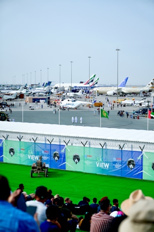 A busy airport scene with various cargo operations in progress.