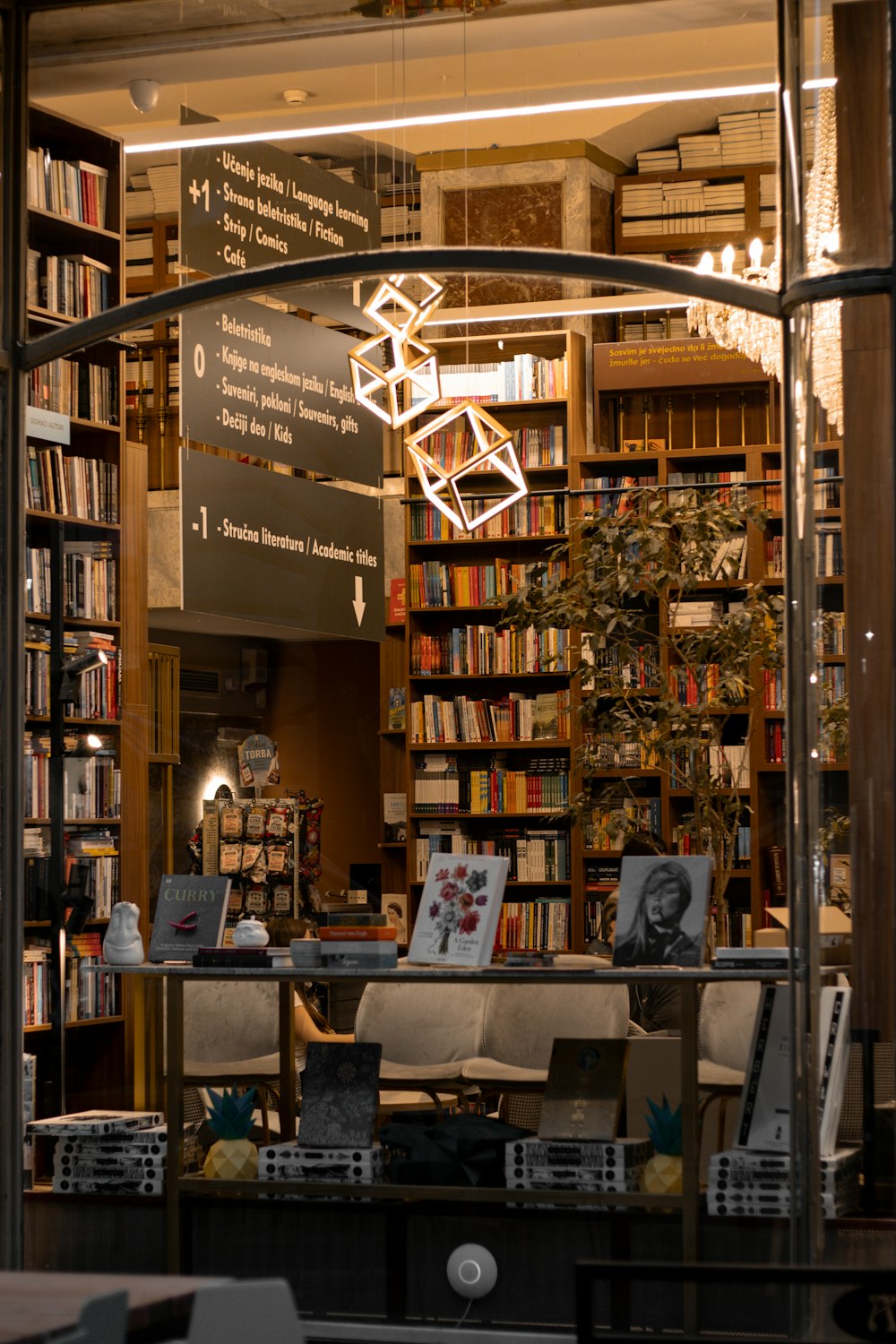 a library filled with lots of books and furniture