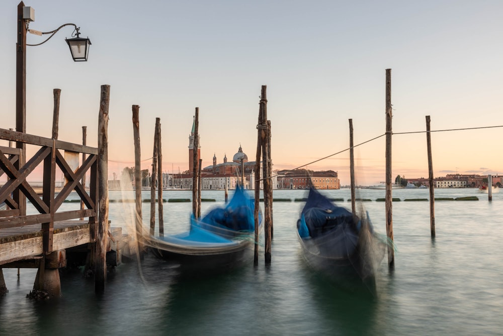 a couple of boats that are sitting in the water