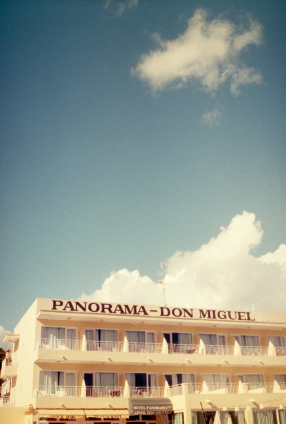 a building with a sign that reads panorama - don miguel