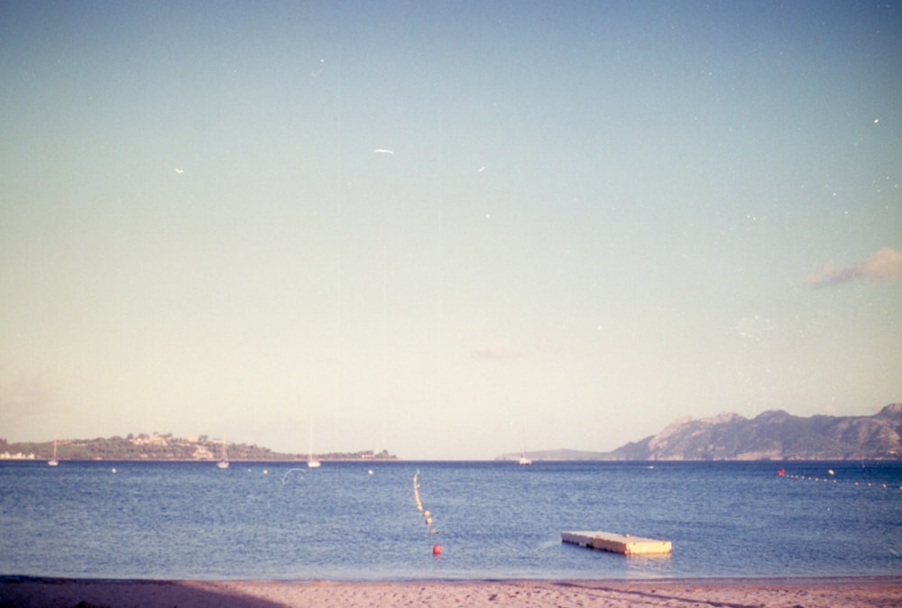 a body of water with boats floating on top of it