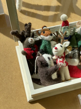a group of stuffed animals sitting on top of a table