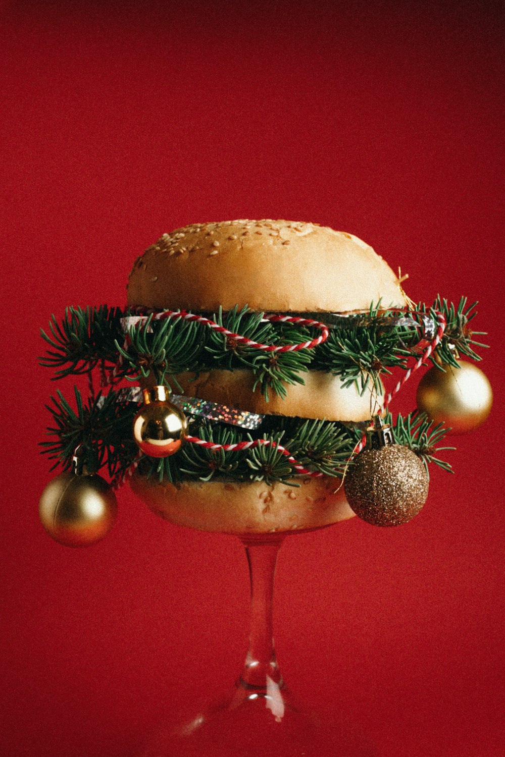 a hamburger with a christmas decoration on top of it