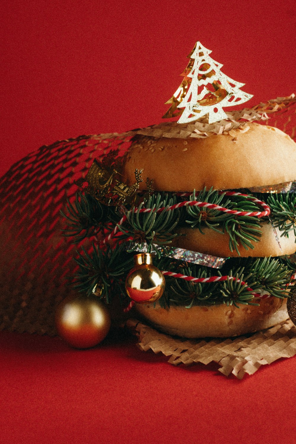 a hamburger with a christmas tree on top of it