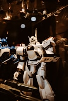 Close-up of team members discussing strategies over a robot.