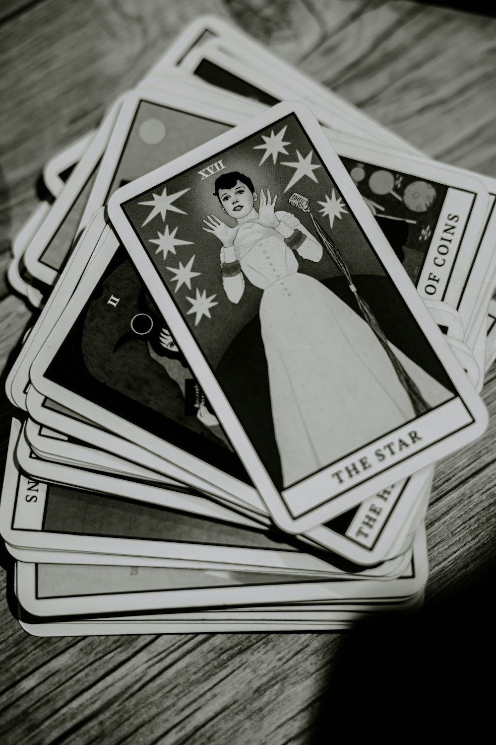 a stack of cards sitting on top of a wooden table