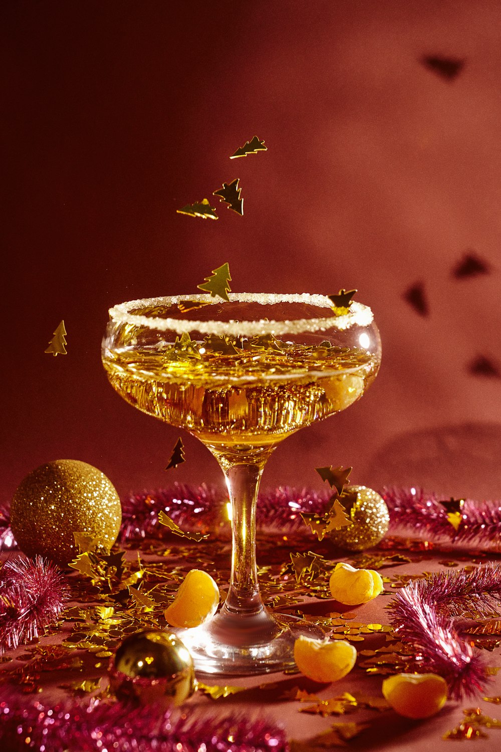 a glass filled with liquid sitting on top of a table