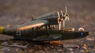 Finished 3D printed war history prop displayed on a rustic wooden table with subtle lighting.