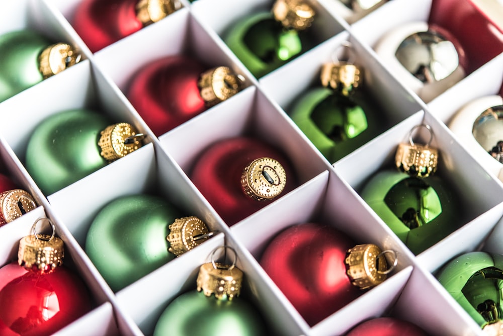 a box filled with lots of different colored ornaments