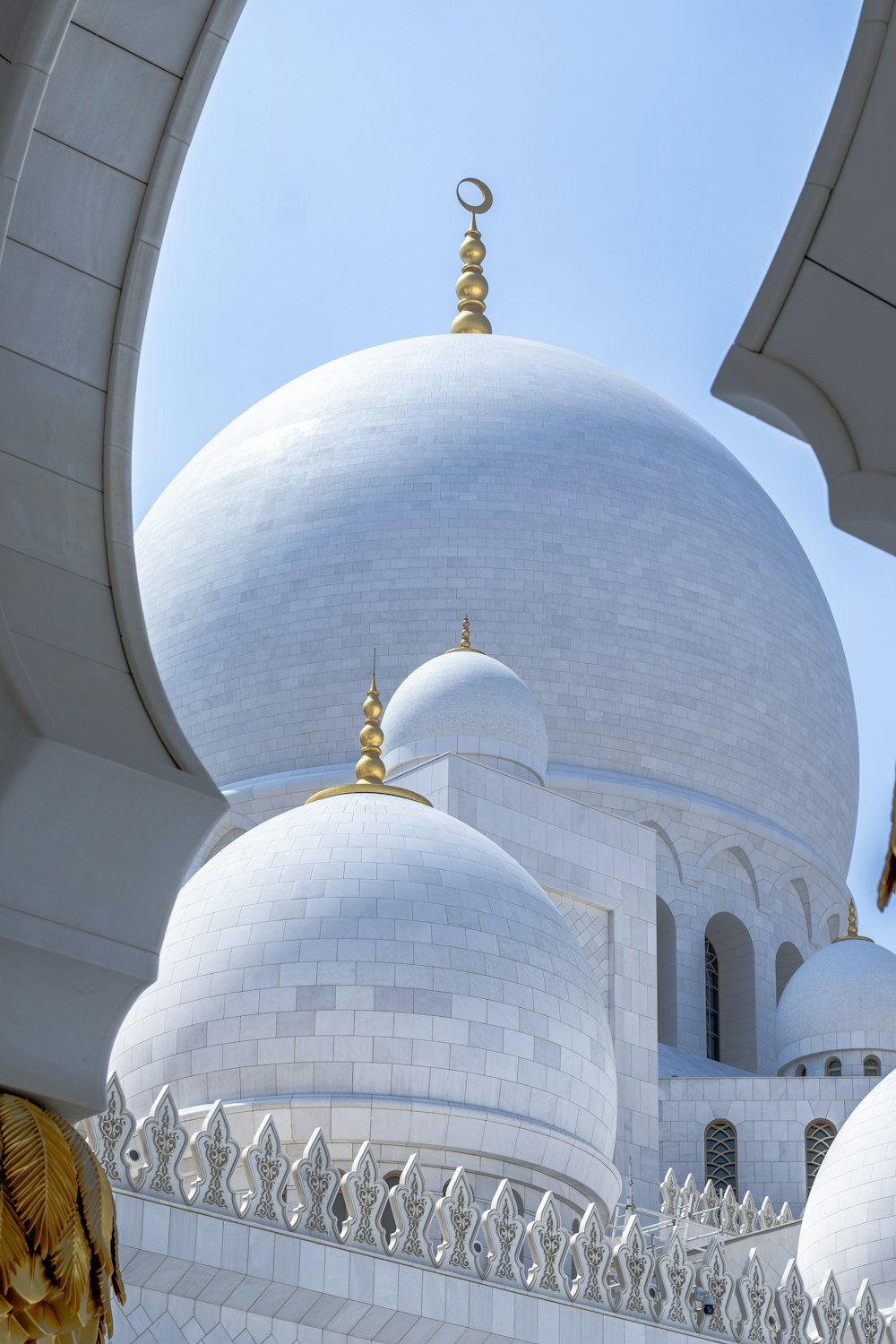 a large white building with many domes on top of it