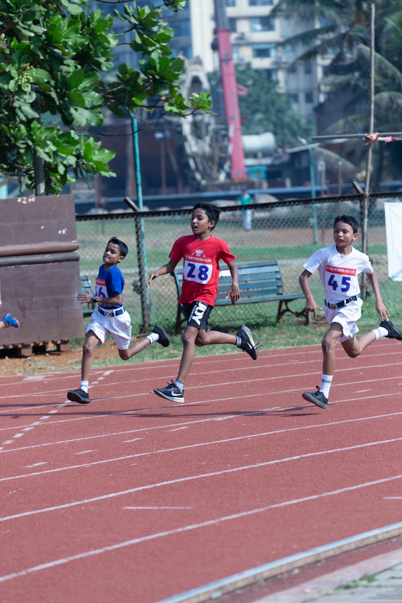 Kids sprinting down a running track