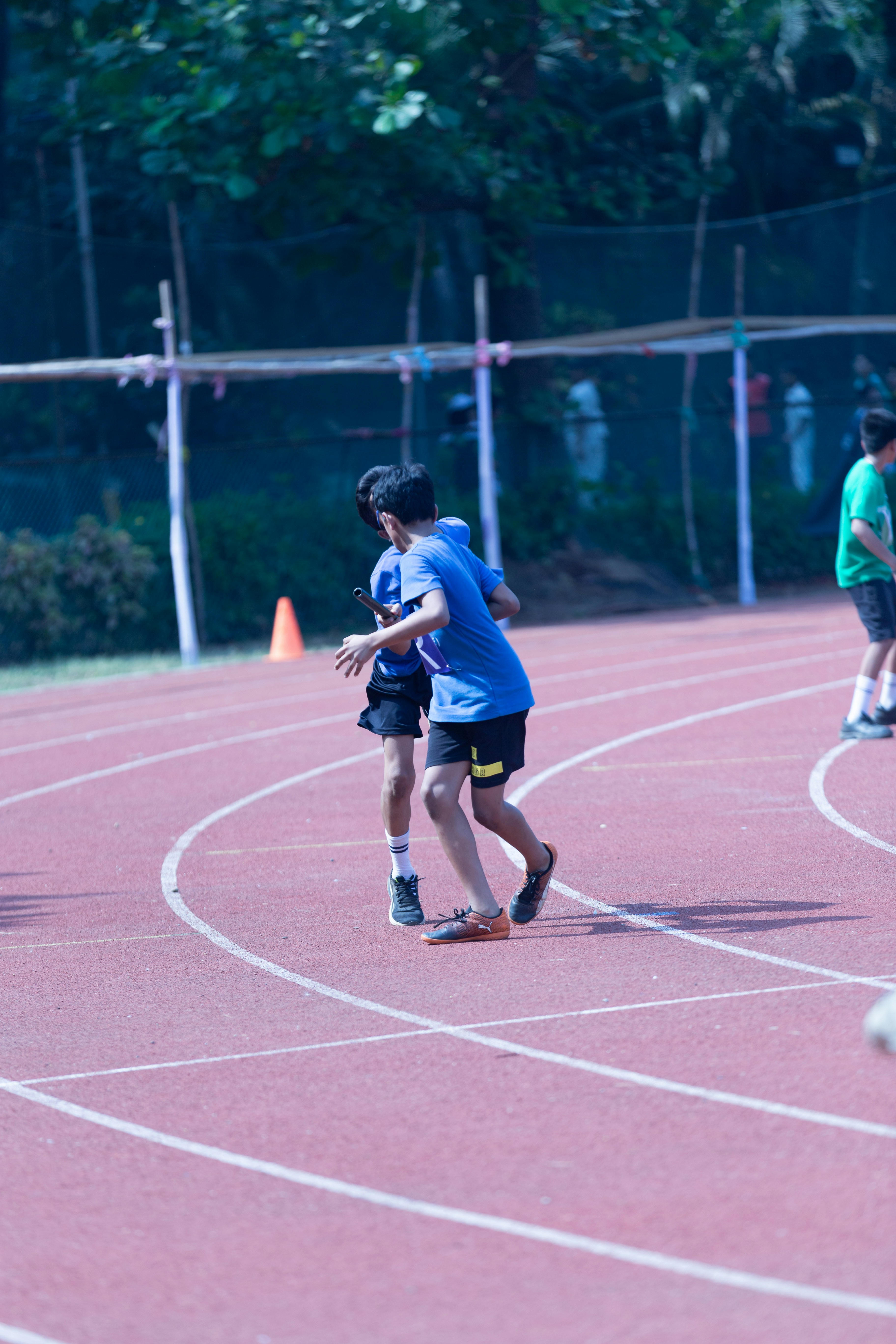 a group of young people playing frisbee