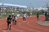 Athletes preparing at the starting line under a clear sky in Las Palmas.