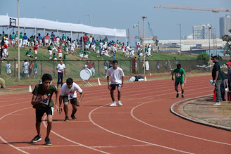 Teams lined up at the starting line, ready to sprint in a friendly relay race.