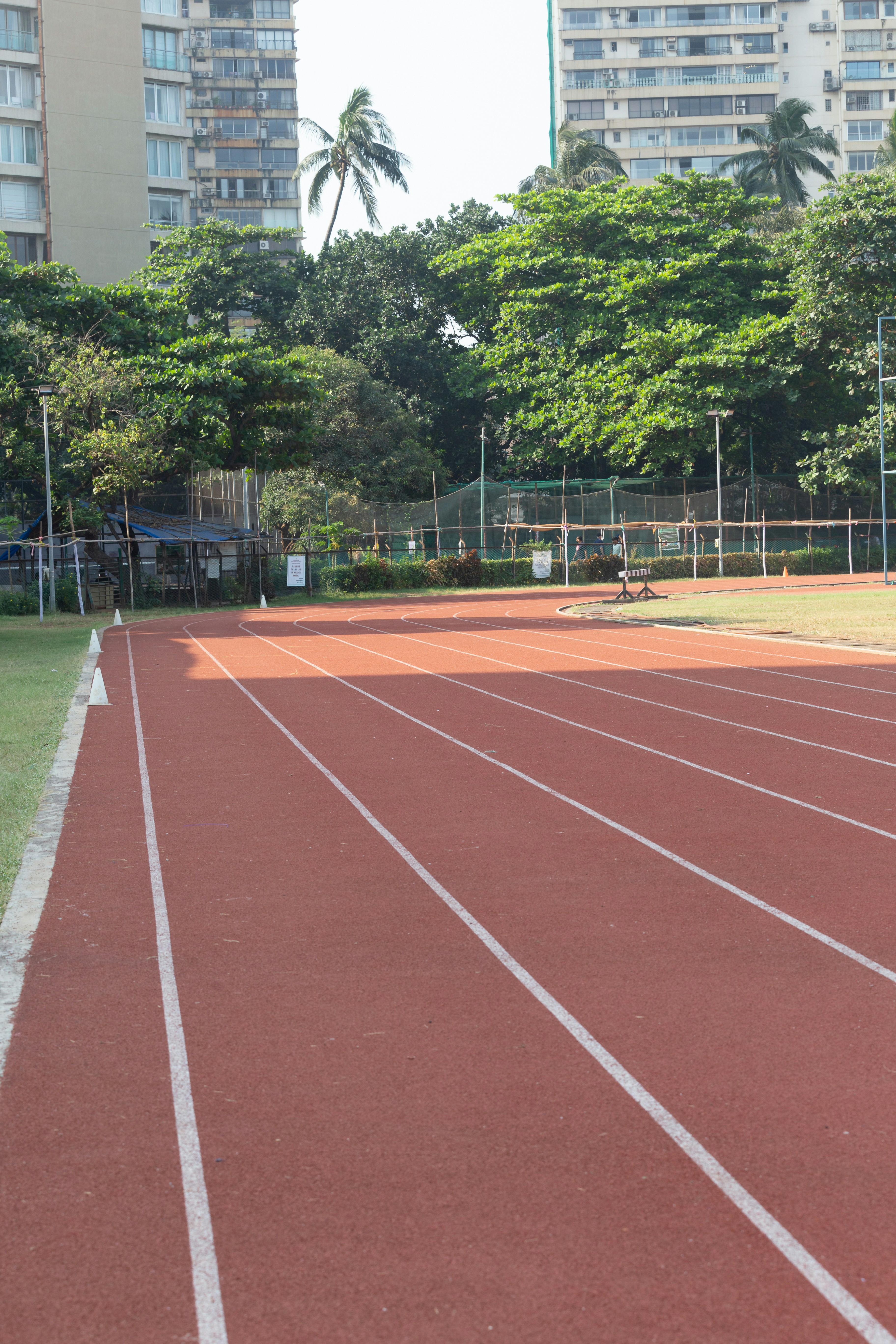 a man standing on a tennis court holding a racquet