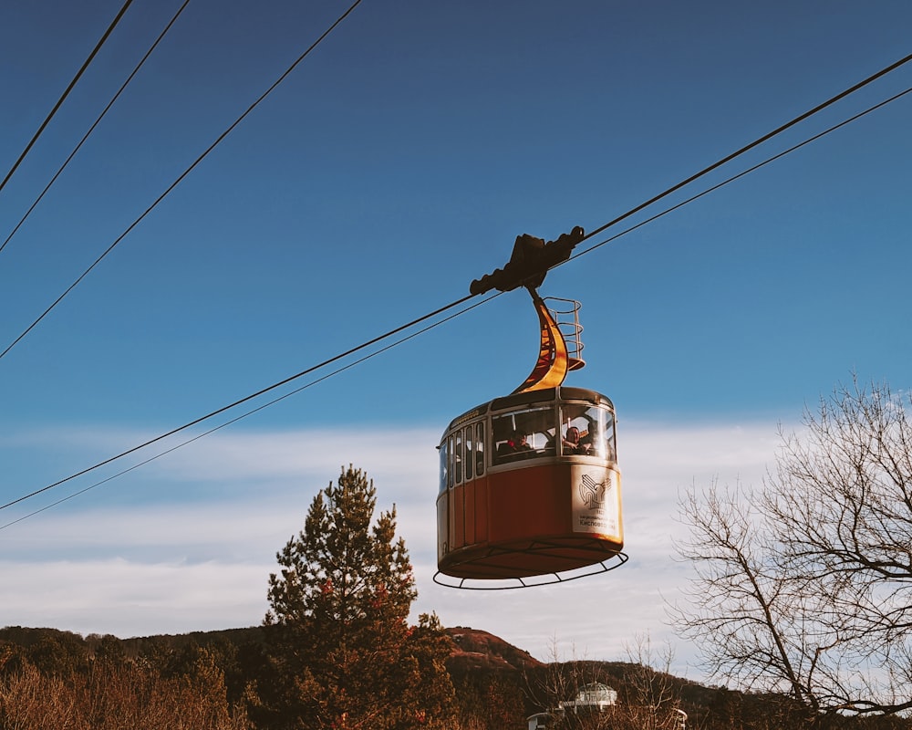 a cable car with a person on top of it