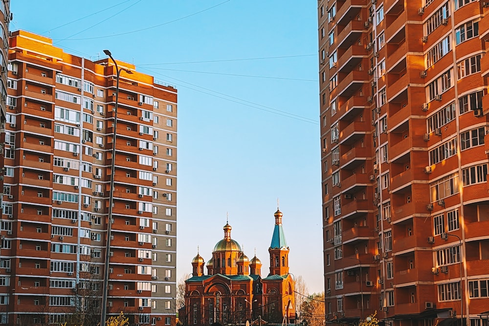 a church in a city surrounded by tall buildings