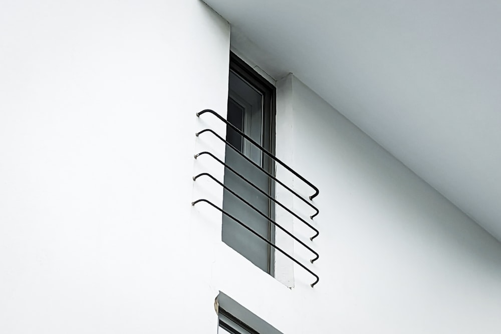 a black and white photo of a window and a window sill