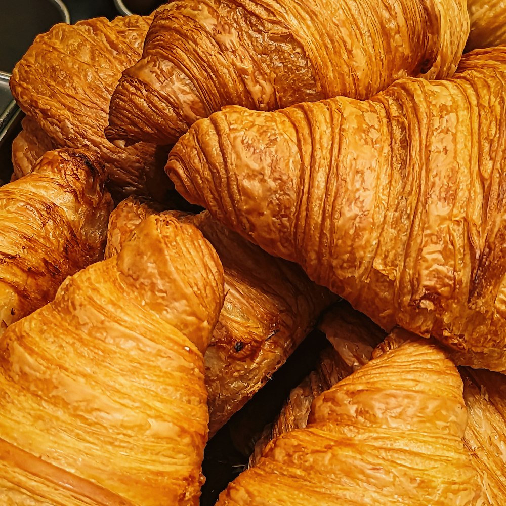 a pile of croissants sitting next to each other