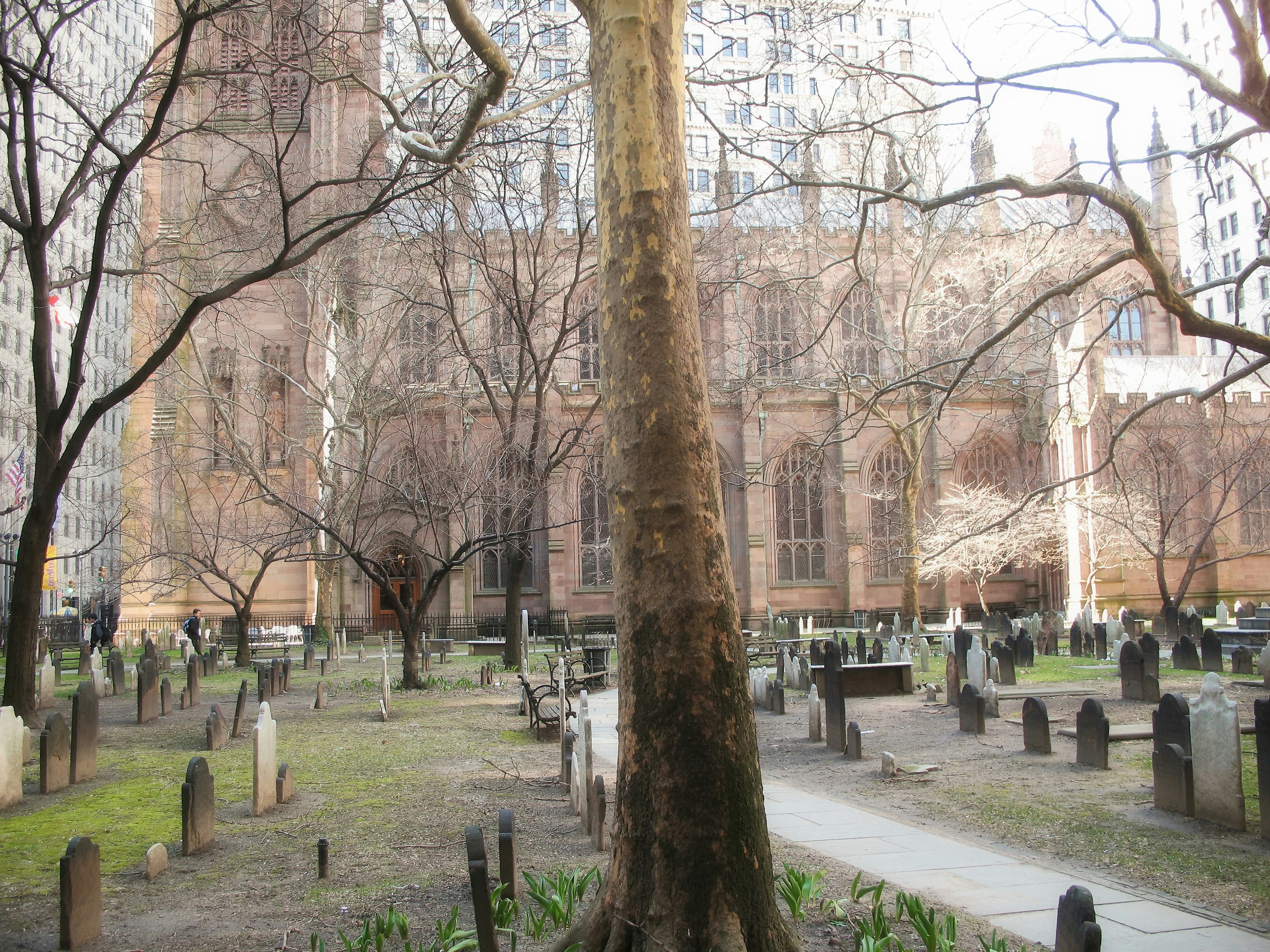 a cemetery in front of a large building, 