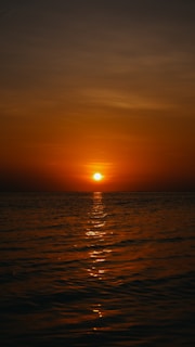 A vibrant sunset over the ocean, symbolizing new opportunities.