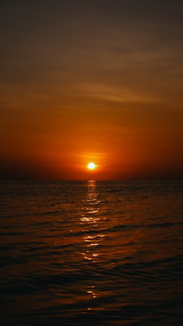 A vibrant sunset over the ocean, symbolizing new opportunities.