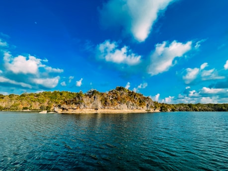 A serene landscape of the Azores islands showcasing lush greenery and blue waters.