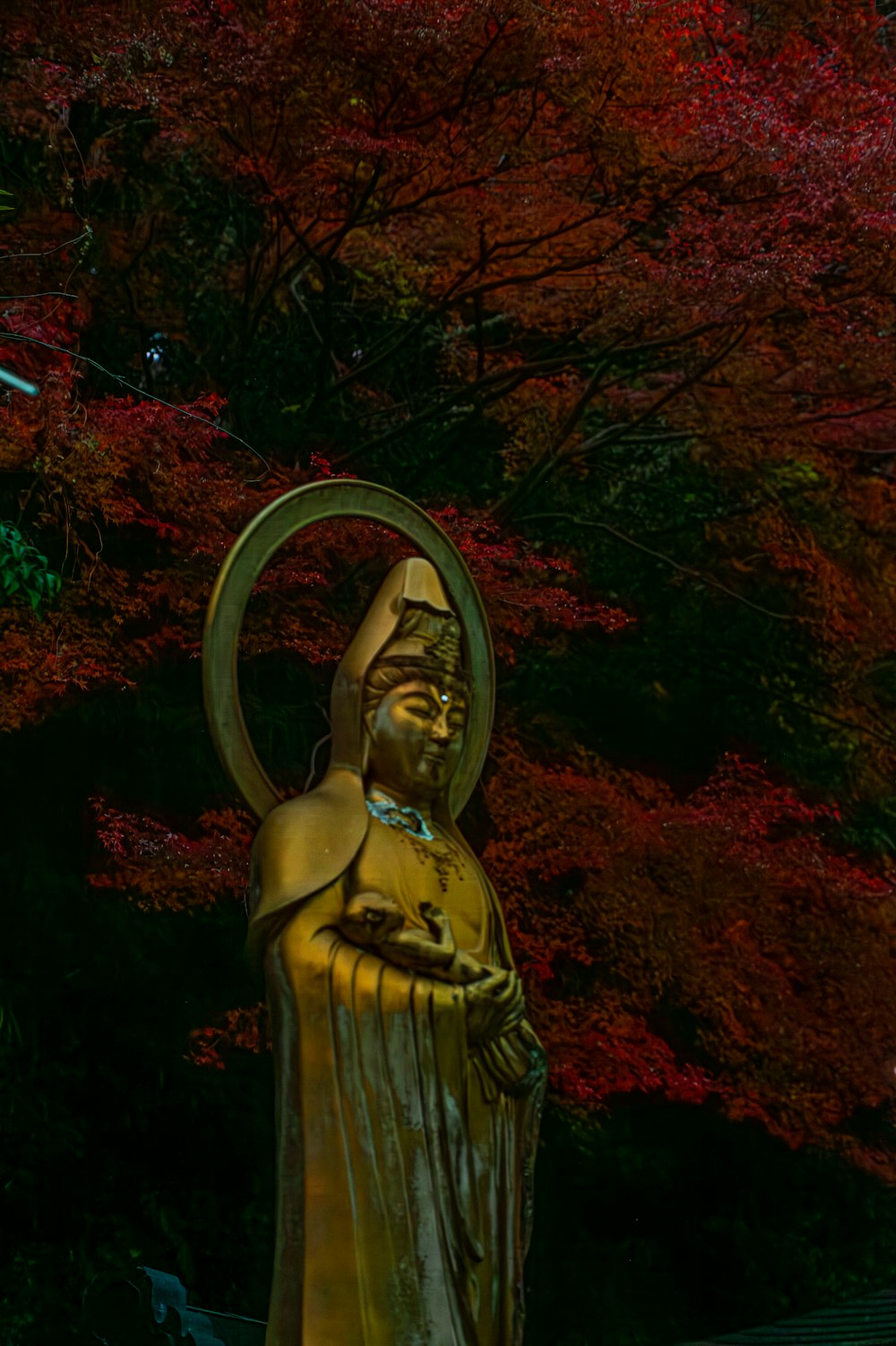 a statue of a person with a ring around their neck