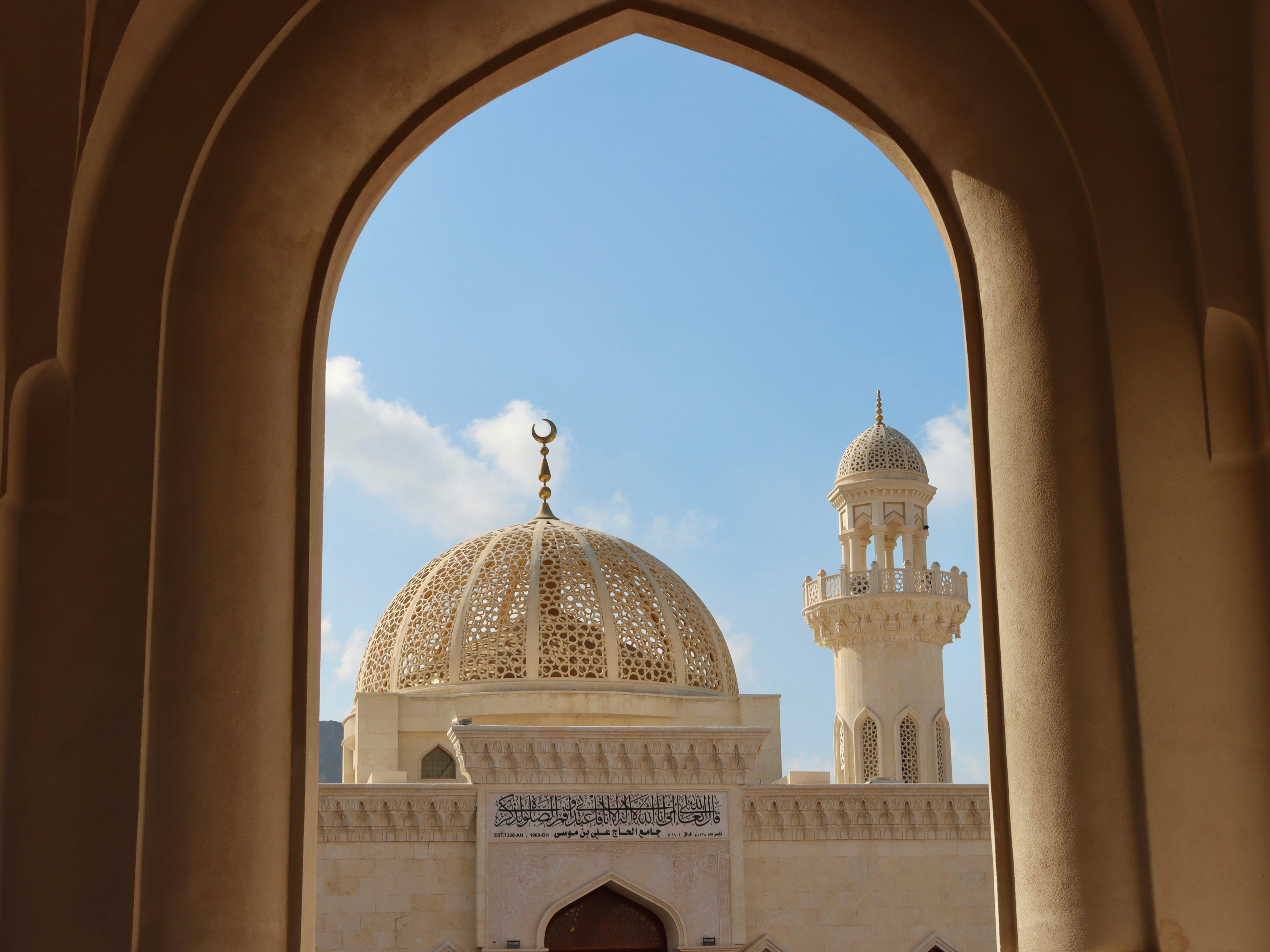 a large white building with a dome on top of it