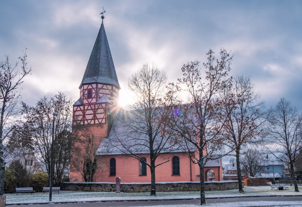 a church with a steeple and a clock tower