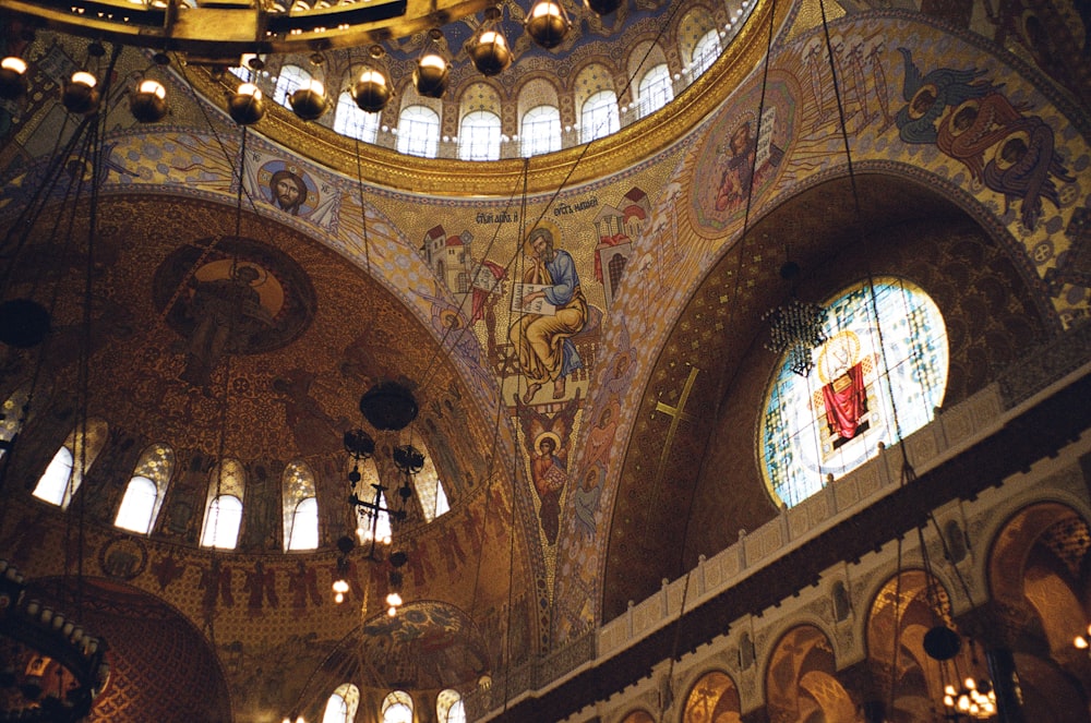 the interior of a church with stained glass windows