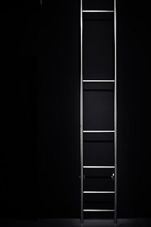 Stacked ladder cable trays made of galvanized iron, highlighting their robust structure