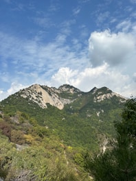 a view of a mountain range from a trail