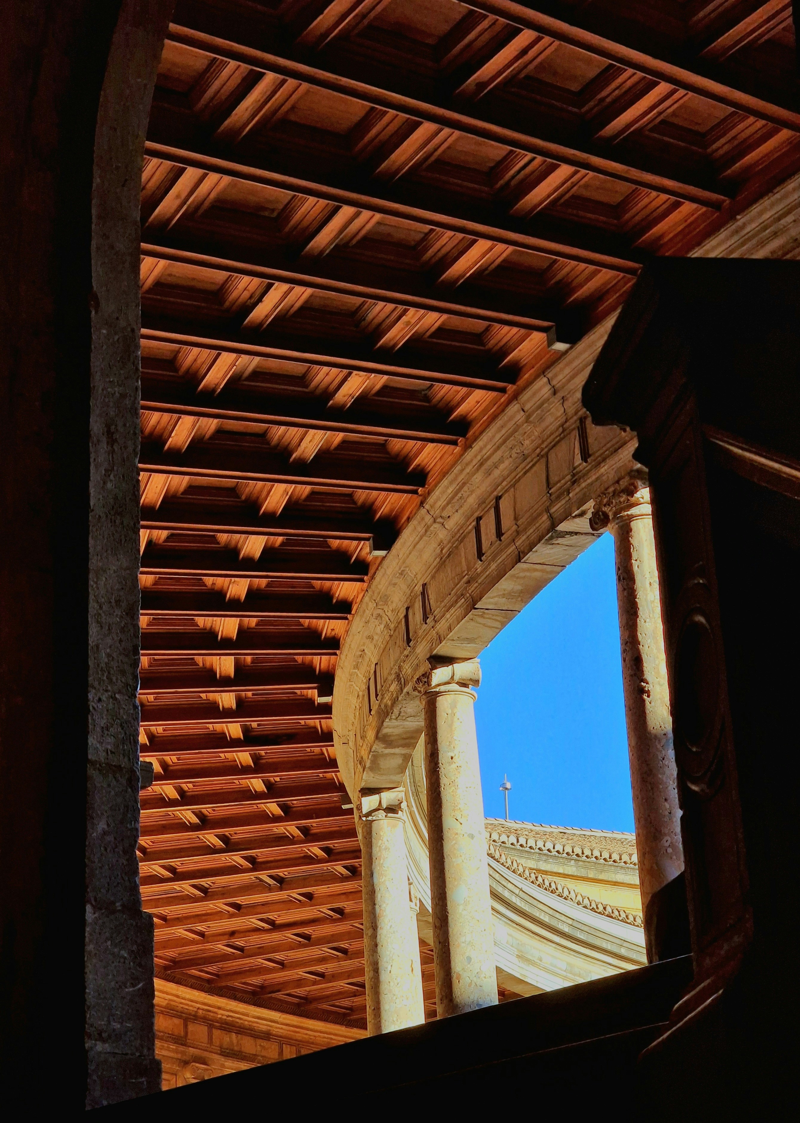 a close up of a building with a sky in the background