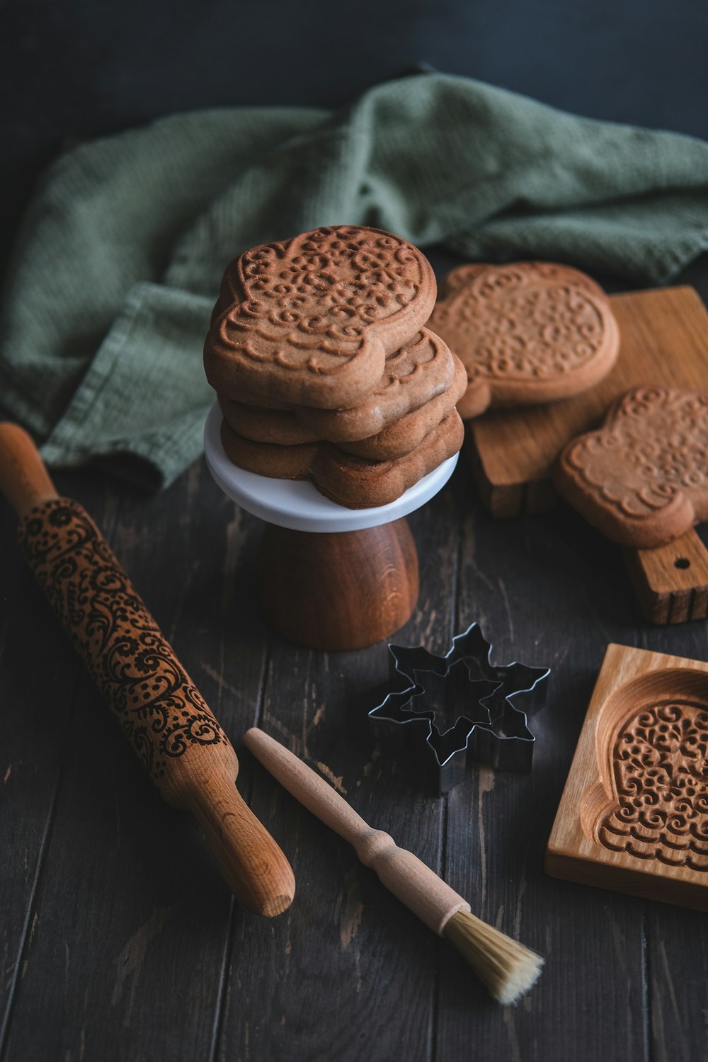 a table topped with cookies and cookies cutters