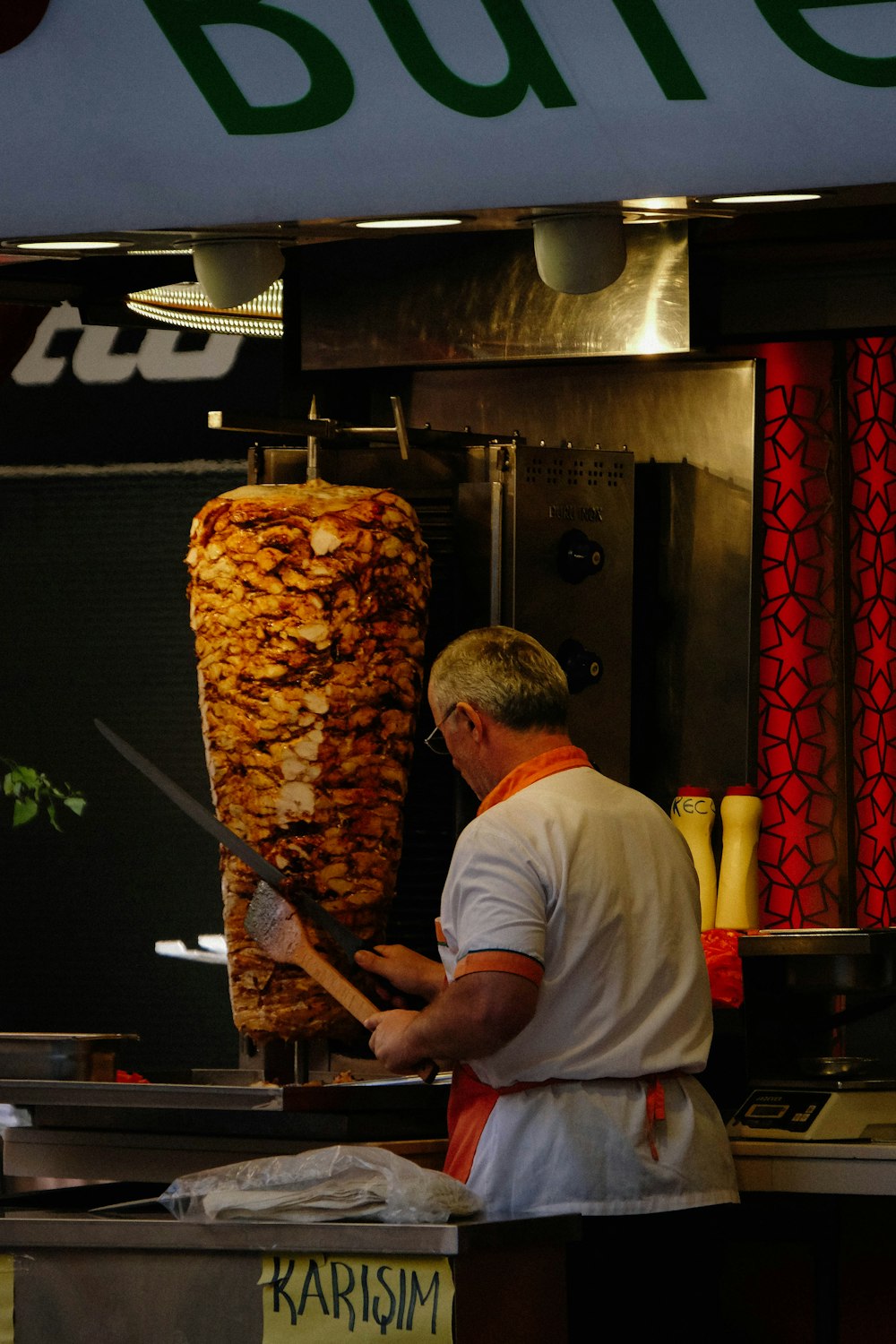 a man is cooking food in a restaurant