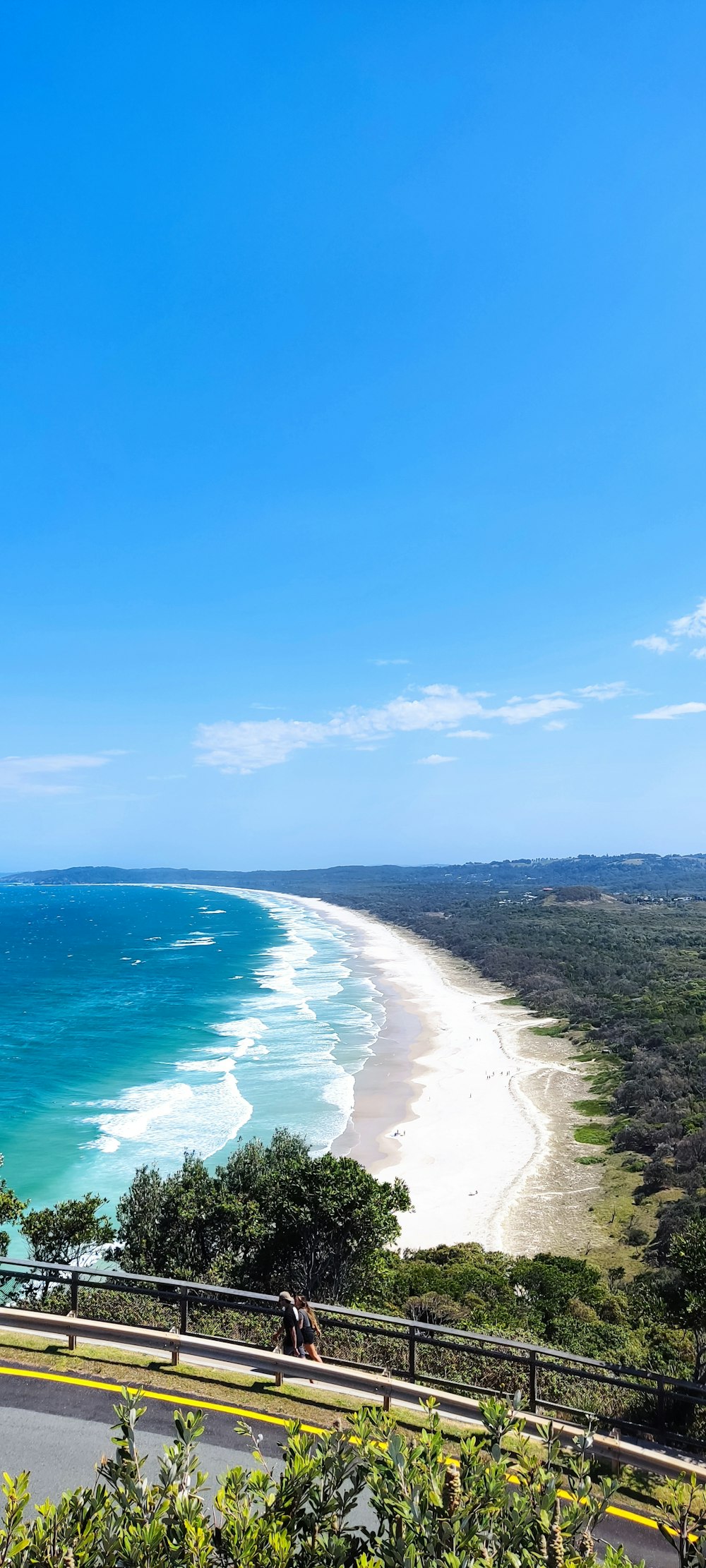 a scenic view of a beach and the ocean