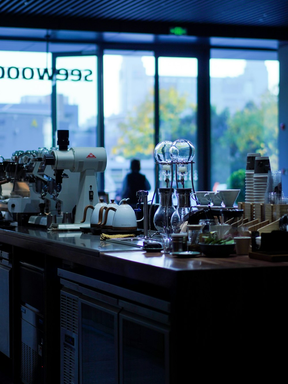 a coffee machine sitting on top of a counter next to a window