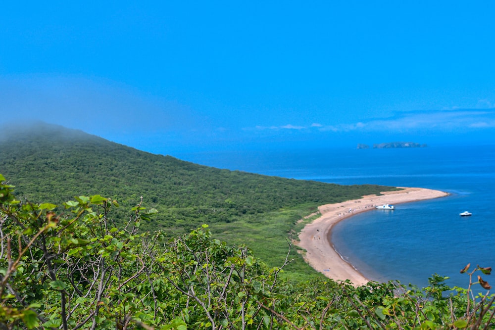 a view of a beach with a boat in the water