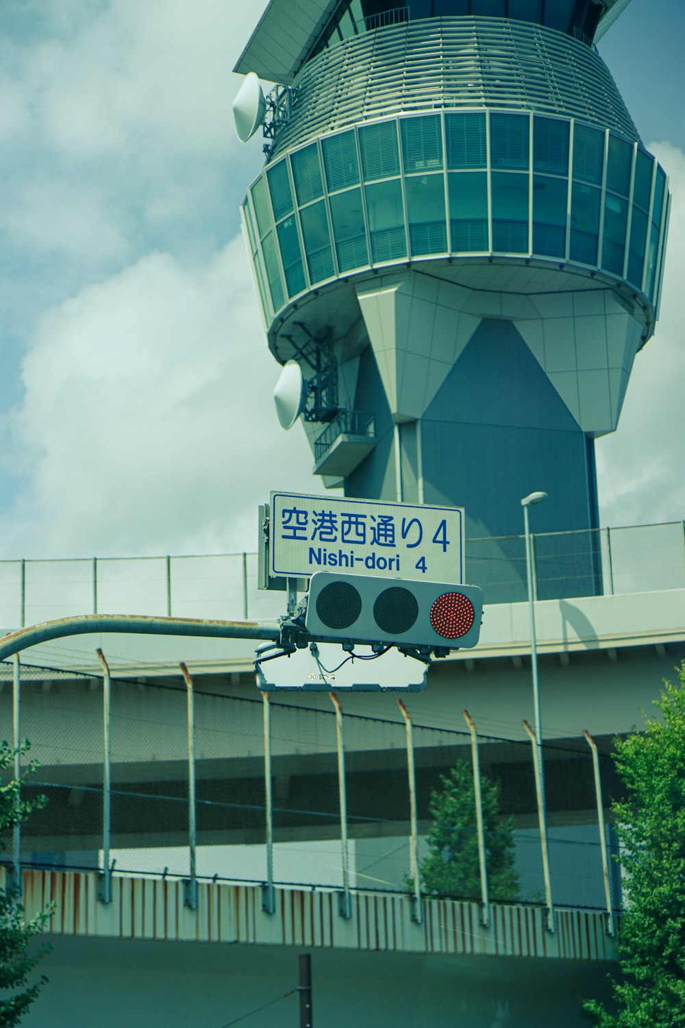 a traffic light in front of a tall building