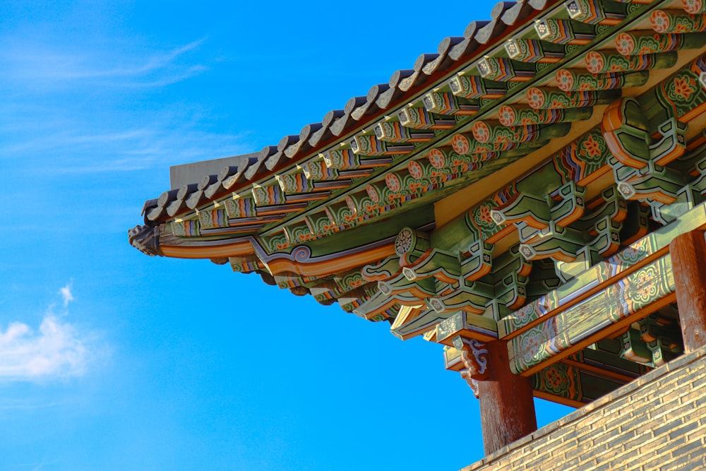 the roof of a building with a blue sky in the background