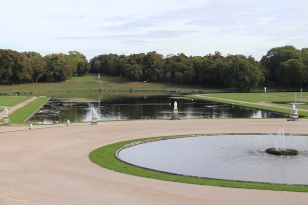 A serene landscape showcasing well-maintained gardens and pristine outdoor spaces.