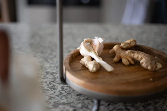 A cozy kitchen scene with jars of ginger powder, garlic powder, and dried vegetable mixes arranged neatly on a counter