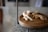 A serene kitchen scene with fresh herbs and spices on a wooden countertop.