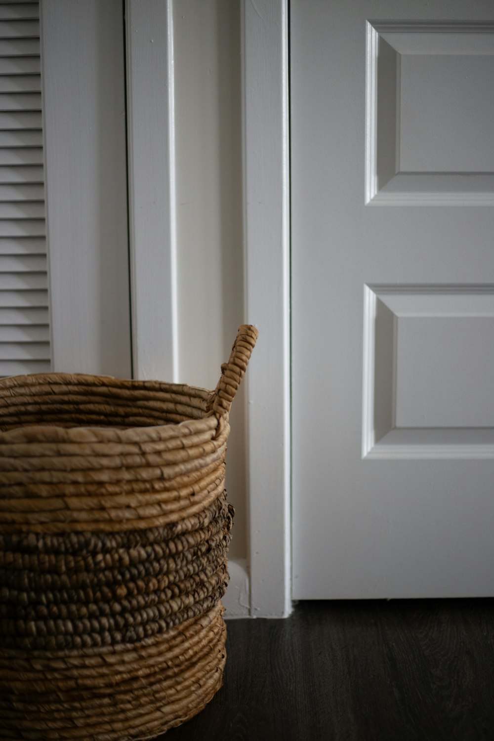 a close up of a basket near a door
