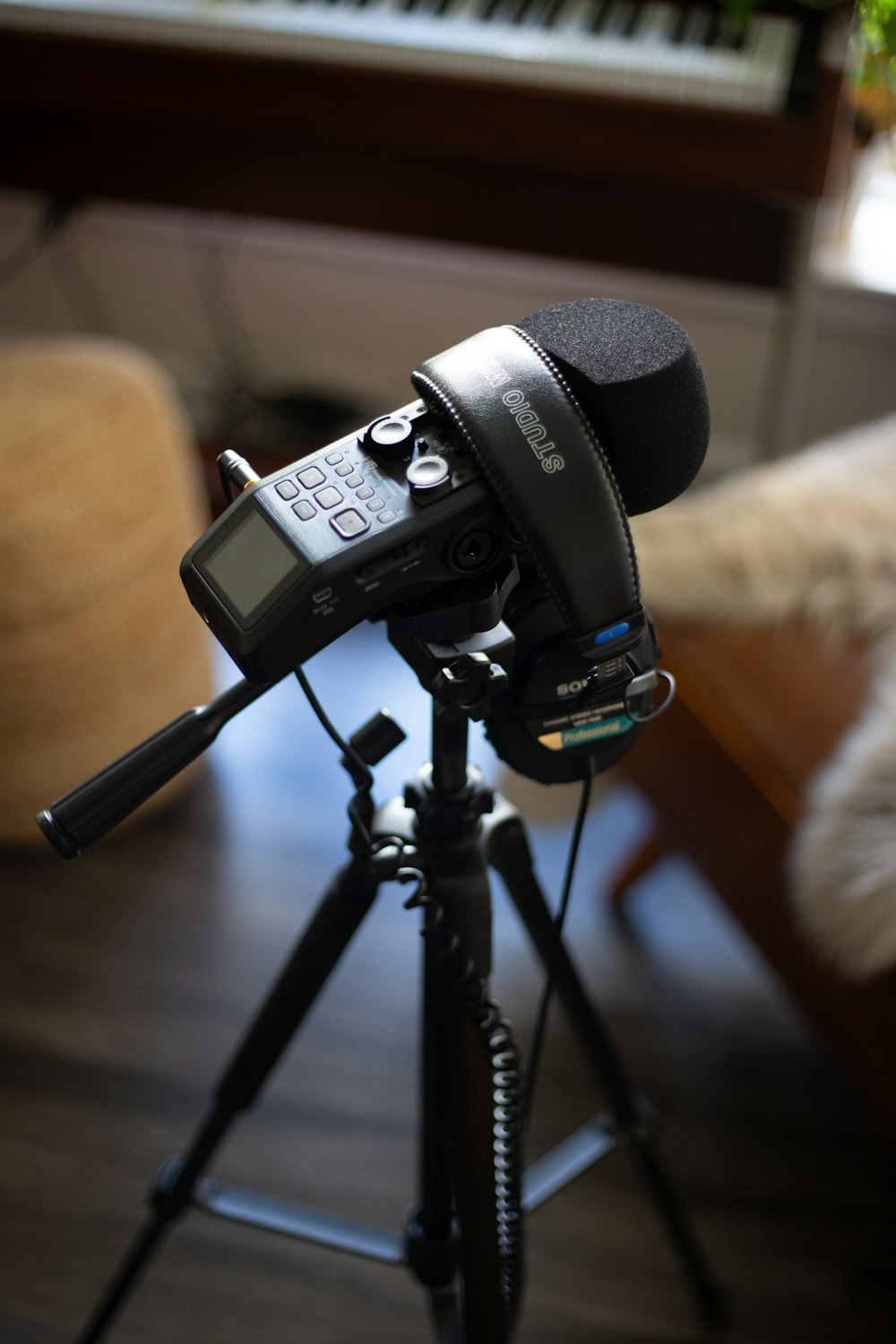 a camera and a microphone on a tripod