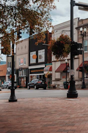 a city street with cars parked on the side of the road