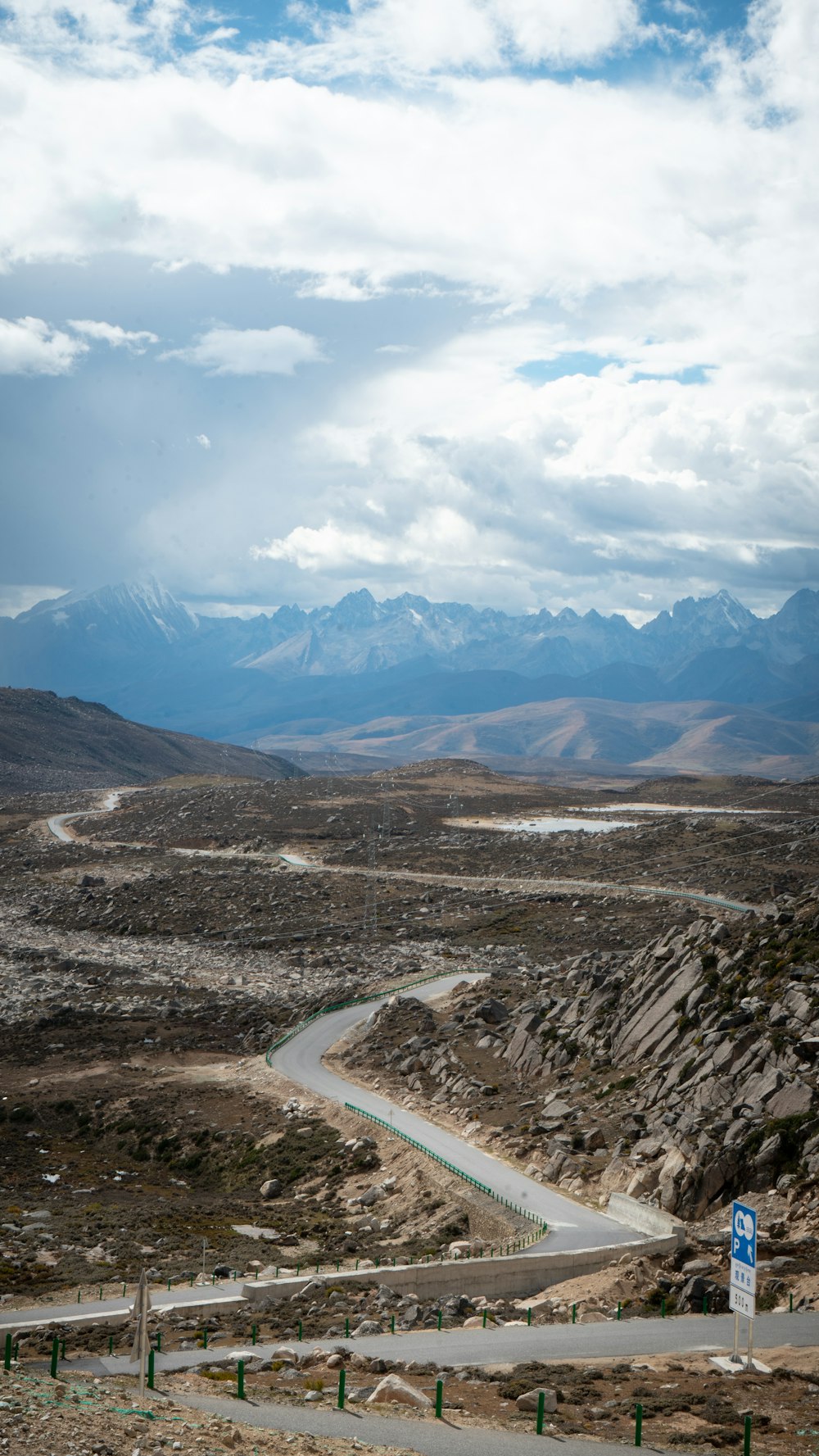 a winding road in the middle of a mountainous area