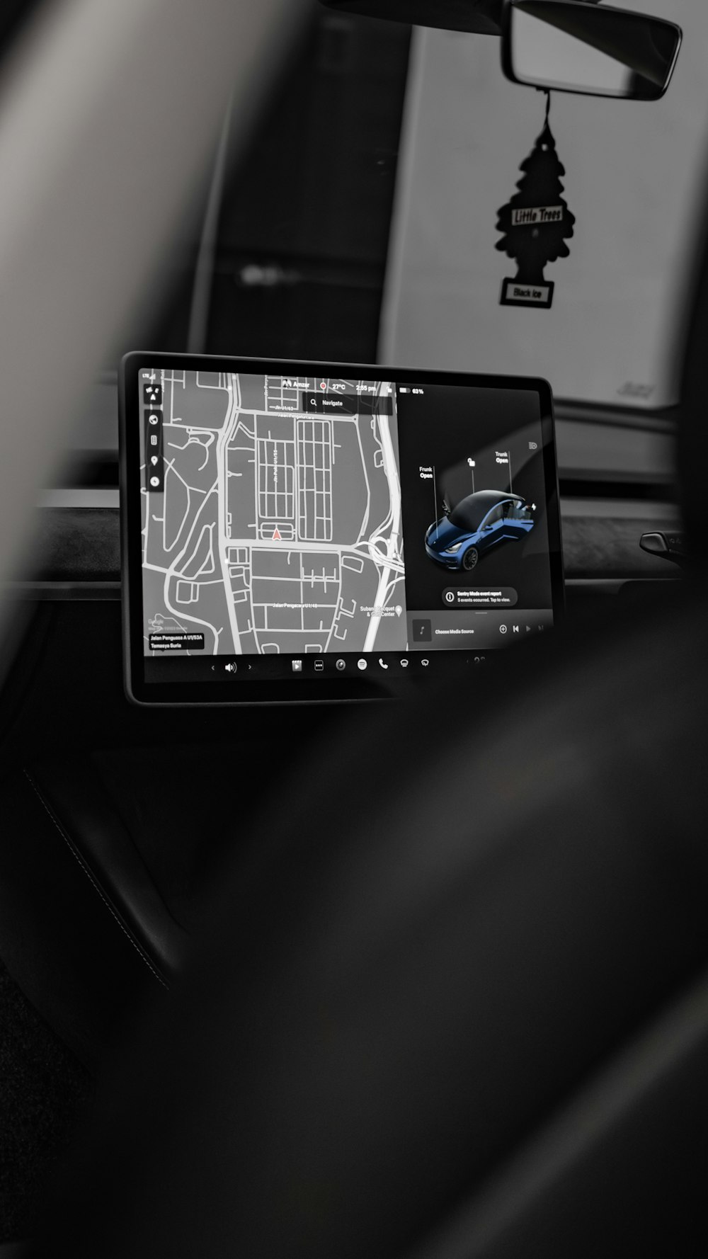 a car dashboard with a gps device in the middle of it