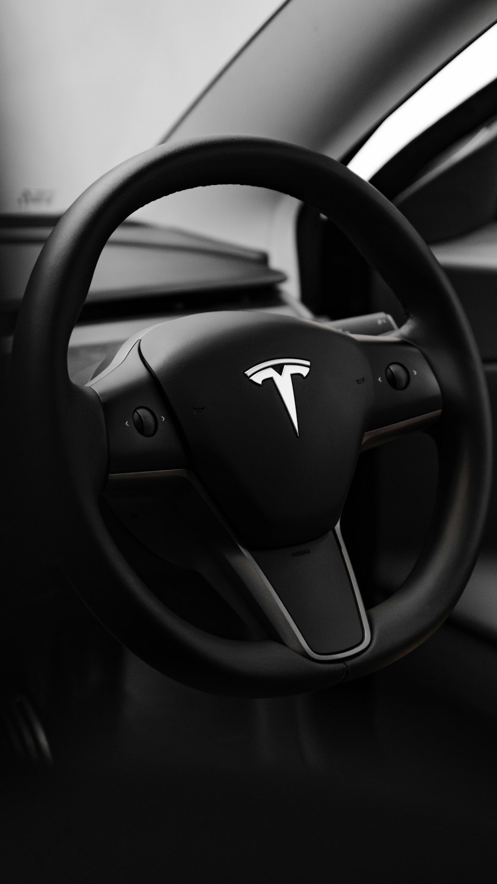 a black and white photo of a car dashboard